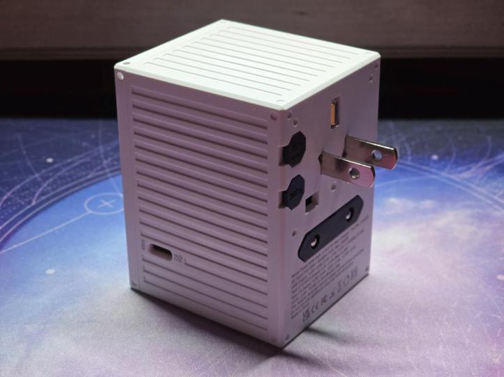 MacBook Air and iPhone charging simultaneously from the EZQuest 65W USB-C PD port.